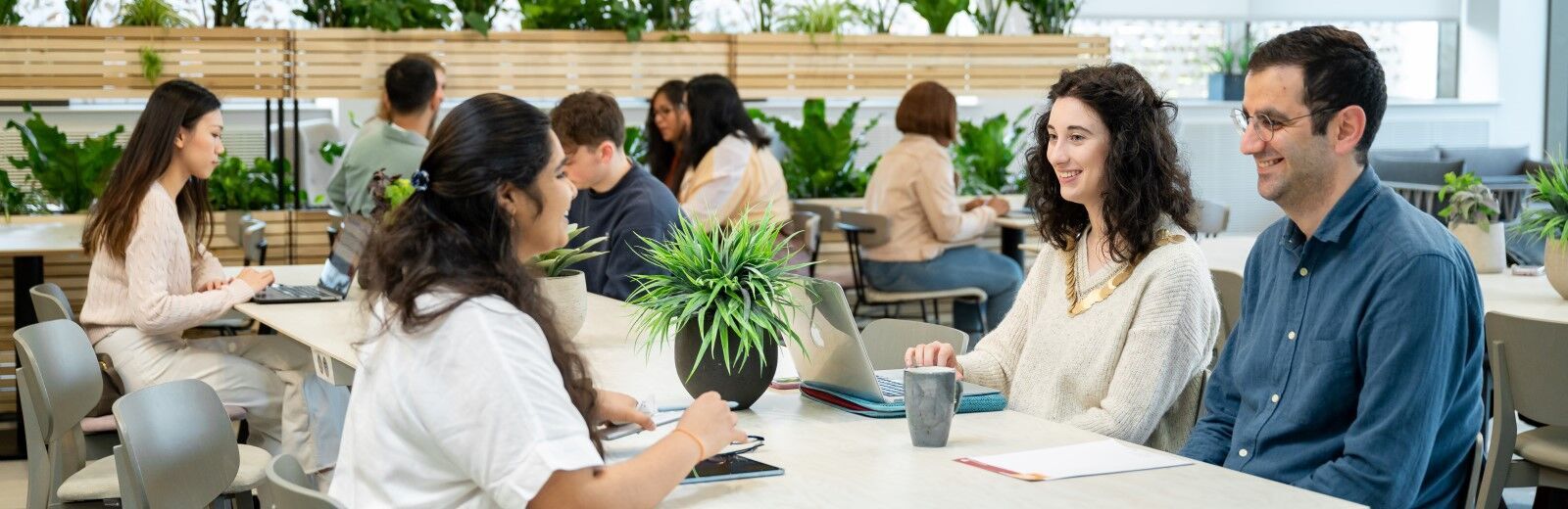 Students working together in a cafe on campus