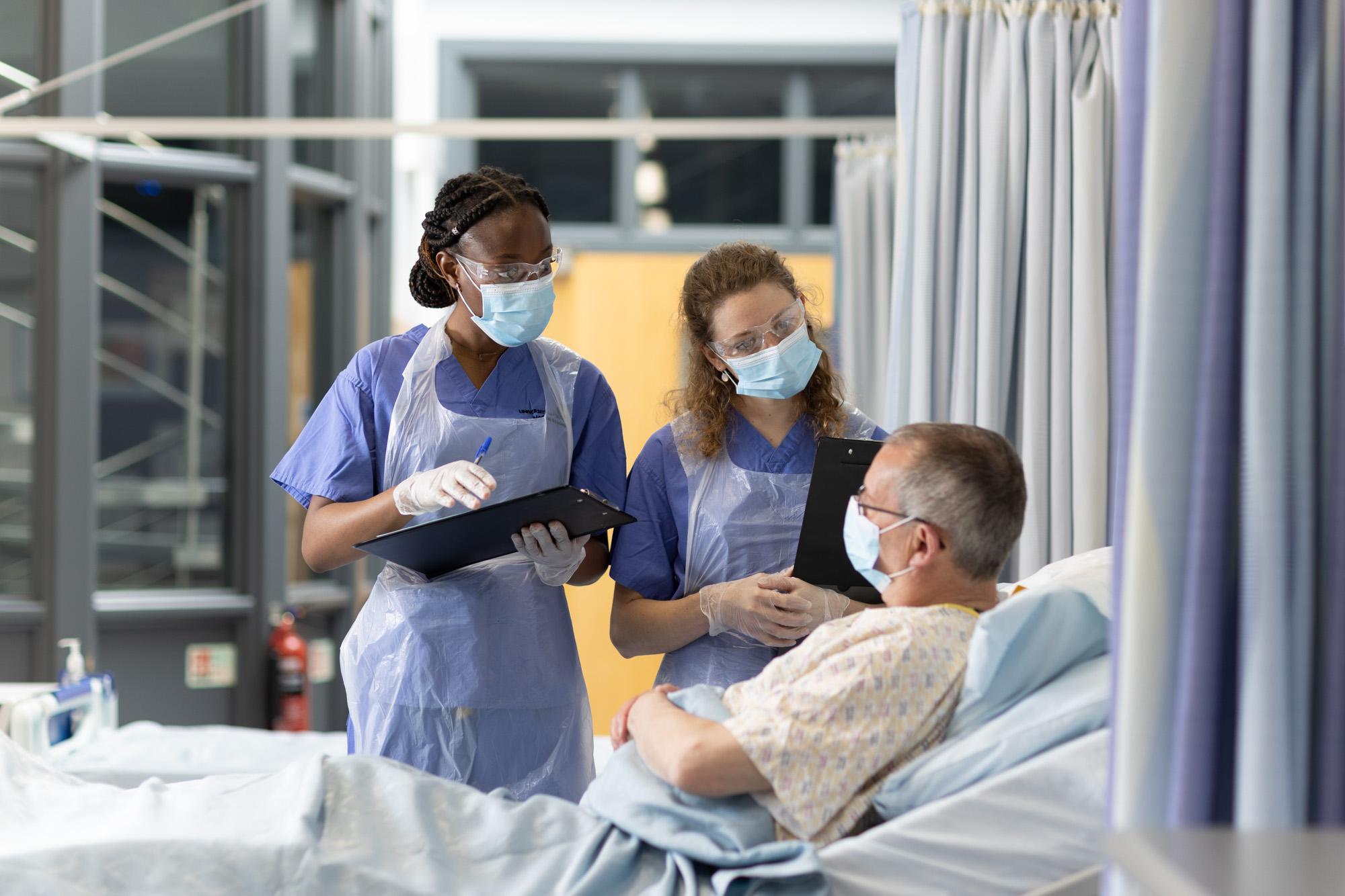 Student doctors take patient history
