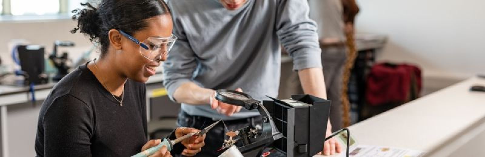 Two students in a physics lab at the University of Leeds.