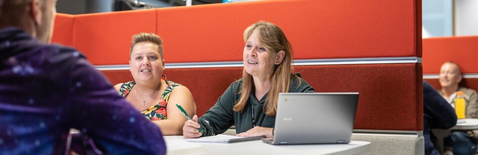 Students chatting around a table