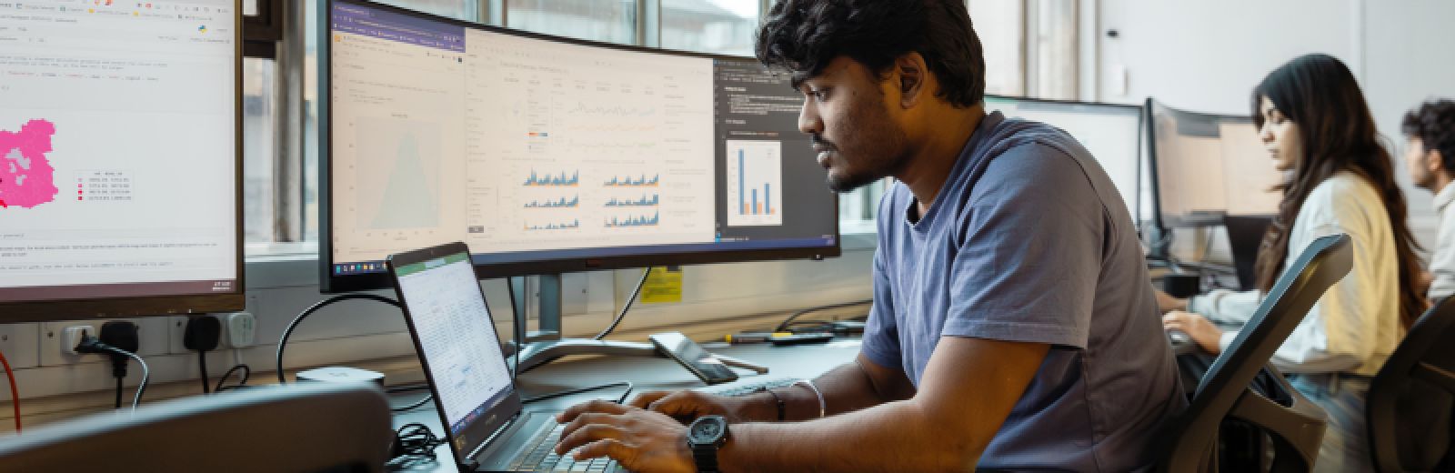 Students in a computer lab looking at data visualisations
