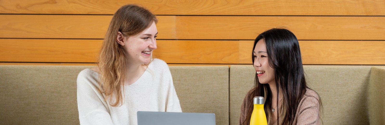 Two students in a study space