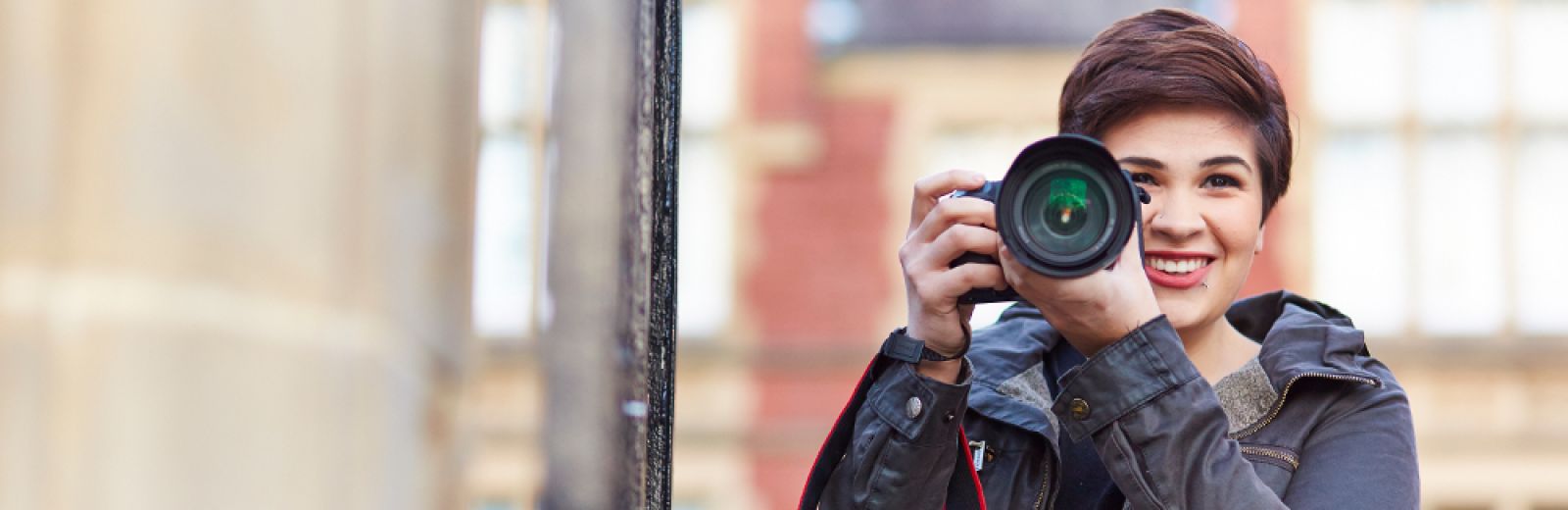 Student holding camera
