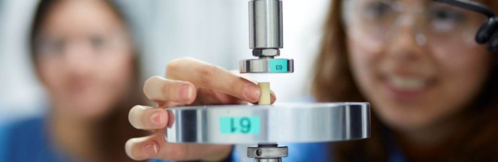 A photograph of two Medical engineering students performing an experiment.